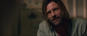 Movie still from “Incarnate” (2016), directed by Brad Peyton – A person with long hair; Close Up shot, Over the shoulder angle