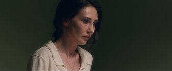 Movie still from “Incarnate” (2016), directed by Brad Peyton – A person wearing a white shirt; Close Up shot, Over the shoulder angle