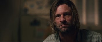 Movie still from “Incarnate” (2016), directed by Brad Peyton – A person with long hair; Close Up shot, Over the shoulder angle