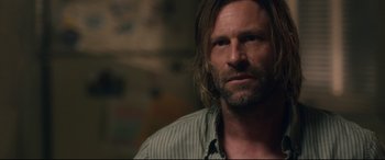 Movie still from “Incarnate” (2016), directed by Brad Peyton – A person with long hair; Close Up shot, Over the shoulder angle
