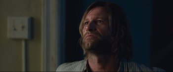 Movie still from “Incarnate” (2016), directed by Brad Peyton – A person with long hair; Close Up shot, Low angle