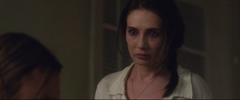 Movie still from “Incarnate” (2016), directed by Brad Peyton – A person wearing a white shirt; Close Up shot, Over the shoulder angle