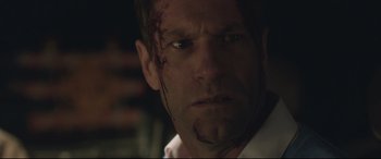 Movie still from “Incarnate” (2016), directed by Brad Peyton – A person with blood all over his face; Close Up shot, Low angle