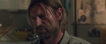 Movie still from “Incarnate” (2016), directed by Brad Peyton – A person with long hair; Close Up shot, Over the shoulder angle