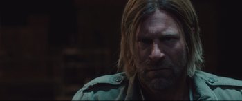 Movie still from “Incarnate” (2016), directed by Brad Peyton – A person with long hair; Close Up shot, Over the shoulder angle