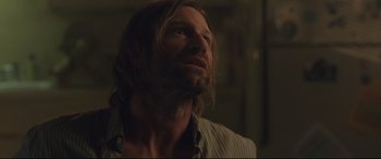Movie still from “Incarnate” (2016), directed by Brad Peyton – A person with long hair looking up; Close Up shot, Over the shoulder angle