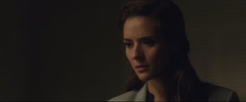 Movie still from “Incarnate” (2016), directed by Brad Peyton – A person wearing a white shirt; Close Up shot, Over the shoulder angle