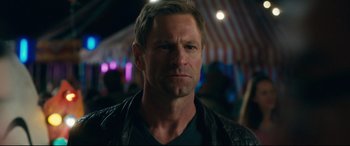 Movie still from “Incarnate” (2016), directed by Brad Peyton – A person wearing a black jacket; Close Up shot, Over the shoulder angle