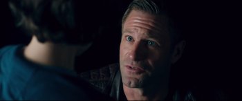 Movie still from “Incarnate” (2016), directed by Brad Peyton – A person wearing a leather jacket; Close Up shot, Over the shoulder angle