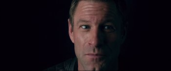 Movie still from “Incarnate” (2016), directed by Brad Peyton – A person wearing a leather jacket; Close Up shot, Low angle