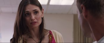 Movie still from “Incarnate” (2016), directed by Brad Peyton – A person wearing a dress; Close Up shot, Over the shoulder angle