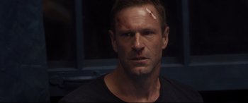 Movie still from “Incarnate” (2016), directed by Brad Peyton – A person with a bandage on his face; Close Up shot, Over the shoulder angle