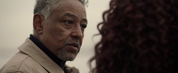 Movie still from “Kaleidoscope” (2023), directed by Mairzee Almas – An older man and a young woman looking at one another; Close Up shot, Over the shoulder angle