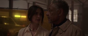 Movie still from “Kaleidoscope” (2023), directed by Mairzee Almas – A man and a woman standing next to each other; Close Up shot, Over the shoulder angle