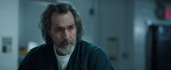 Movie still from “Kaleidoscope” (2023), directed by Mairzee Almas – A person with long hair; Close Up shot, Over the shoulder angle