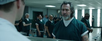 Movie still from “Kaleidoscope” (2023), directed by Mairzee Almas – A group of men standing in front of a bathroom mirror; Medium shot, Over the shoulder angle