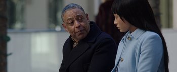 Movie still from “Kaleidoscope” (2023), directed by Mairzee Almas – An older man and a young woman are sitting together; Close Up shot, Over the shoulder angle