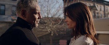 Movie still from “Kaleidoscope” (2023), directed by Mairzee Almas – A man and a woman face to face in front of trees; Close Up shot, Over the shoulder angle
