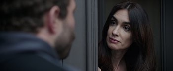 Movie still from “Kaleidoscope” (2023), directed by Mairzee Almas – A man and a woman looking at one another; Close Up shot, Over the shoulder angle