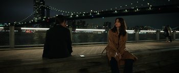 Movie still from “Kaleidoscope” (2023), directed by Mairzee Almas – A woman sitting on a bench next to another woman; Medium shot, Over the shoulder angle