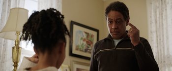 Movie still from “Kaleidoscope” (2023), directed by Mairzee Almas – A woman standing in front of a mirror looking at herself in the mirror; Close Up shot, Over the shoulder angle