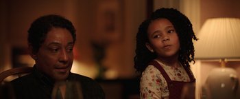 Movie still from “Kaleidoscope” (2023), directed by Mairzee Almas – A young girl and a man are looking at something; Close Up shot, Over the shoulder angle