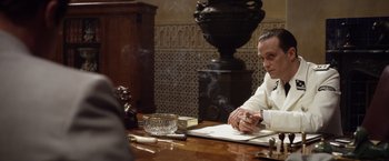 Movie still from “Allied” (2016), directed by Robert Zemeckis – Medium shot, Over the shoulder angle