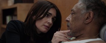 Movie still from “Kaleidoscope” (2023), directed by Mairzee Almas – A woman looking at a man with a concerned look on his face; Close Up shot, Over the shoulder angle