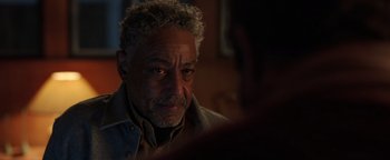 Movie still from “Kaleidoscope” (2023), directed by Mairzee Almas – An older man sitting in front of a mirror; Close Up shot, Over the shoulder angle