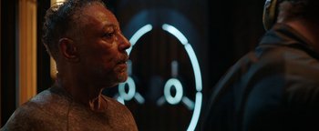 Movie still from “Kaleidoscope” (2023), directed by Mairzee Almas – An older man is looking at a clock; Close Up shot, Over the shoulder angle
