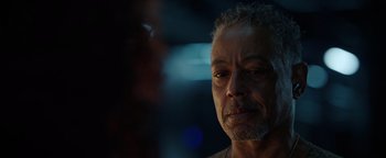 Movie still from “Kaleidoscope” (2023), directed by Mairzee Almas – A person looking at the camera; Close Up shot, Over the shoulder angle