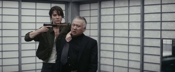 Movie still from “Kate” (2021), directed by Cedric Nicolas-Troyan – Medium shot, Over the shoulder angle