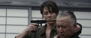 Movie still from “Kate” (2021), directed by Cedric Nicolas-Troyan – Close Up shot, Over the shoulder angle