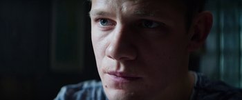 Movie still from “Kidnapping Stella” (2019), directed by Thomas Sieben – A man's face with blue eyes; Close Up shot, Low angle