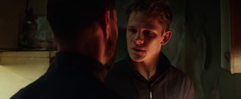 Movie still from “Kidnapping Stella” (2019), directed by Thomas Sieben – A man looking at his reflection in a mirror; Close Up shot, Over the shoulder angle