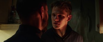 Movie still from “Kidnapping Stella” (2019), directed by Thomas Sieben – A man looking into a mirror with a beard on; Close Up shot, Over the shoulder angle