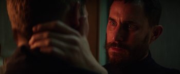 Movie still from “Kidnapping Stella” (2019), directed by Thomas Sieben – A person with a beard looking at the camera; Close Up shot, Over the shoulder angle