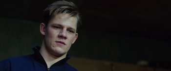 Movie still from “Kidnapping Stella” (2019), directed by Thomas Sieben – A young man is looking into the camera; Close Up shot, Low angle