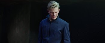 Movie still from “Kidnapping Stella” (2019), directed by Thomas Sieben – A man with blonde hair and a blue jacket; Close Up shot, Low angle