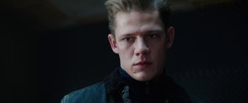 Movie still from “Kidnapping Stella” (2019), directed by Thomas Sieben – A young man with blonde spiky hair wearing a black jacket; Close Up shot, Low angle