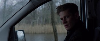 Movie still from “Kidnapping Stella” (2019), directed by Thomas Sieben – A young man looking out of the window of a car; Close Up shot, Over the shoulder angle