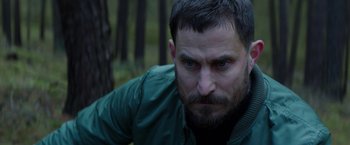 Movie still from “Kidnapping Stella” (2019), directed by Thomas Sieben – A person wearing a jacket; Close Up shot, Over the shoulder angle