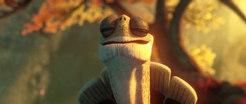 Movie still from “Kung Fu Panda 3” (2016), directed by Jennifer Yuh Nelson – A lizard's face with a smile; Extreme Close Up shot, Low angle