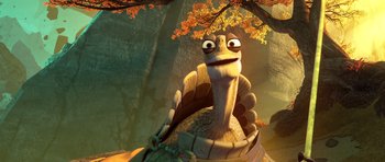 Movie still from “Kung Fu Panda 3” (2016), directed by Jennifer Yuh Nelson – An animated character is sitting on top of a tree; Close Up shot, Low angle