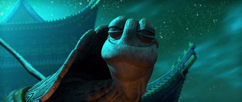 Movie still from “Kung Fu Panda 3” (2016), directed by Jennifer Yuh Nelson – View of a creature with a green background; Close Up shot, Low angle