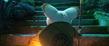 Movie still from “Kung Fu Panda 3” (2016), directed by Jennifer Yuh Nelson – The back end of a stuffed animal in a backpack; Medium shot, Over the shoulder angle