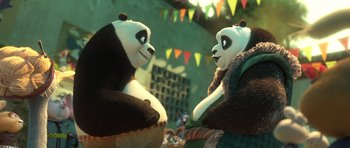 Movie still from “Kung Fu Panda 3” (2016), directed by Jennifer Yuh Nelson – A couple of stuffed pandas sitting next to each other; Medium shot, Over the shoulder angle