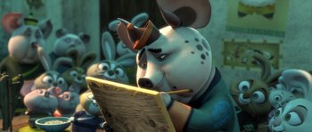 Movie still from “Kung Fu Panda 3” (2016), directed by Jennifer Yuh Nelson – A cartoon dog wearing a hat is holding a pencil and looking at a piece of paper; Close Up shot, Over the shoulder angle