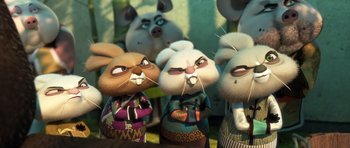 Movie still from “Kung Fu Panda 3” (2016), directed by Jennifer Yuh Nelson – A group of stuffed animals that are standing in a row; Medium shot, Low angle