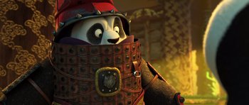 Movie still from “Kung Fu Panda 3” (2016), directed by Jennifer Yuh Nelson – A panda bear is wearing a red helmet and armor; Close Up shot, Low angle